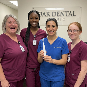 Dental team holding Essoon at their clinic